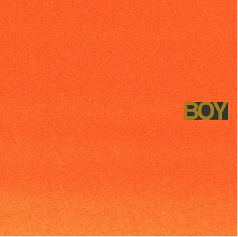Album cover: the word BOY on a plain orange background