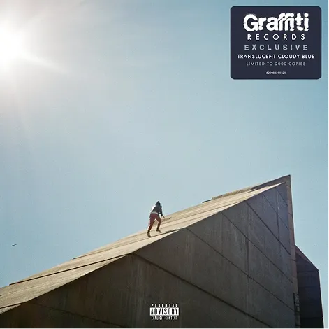 Album cover: a small figure climbing the slope of a concrete building against a bright sky